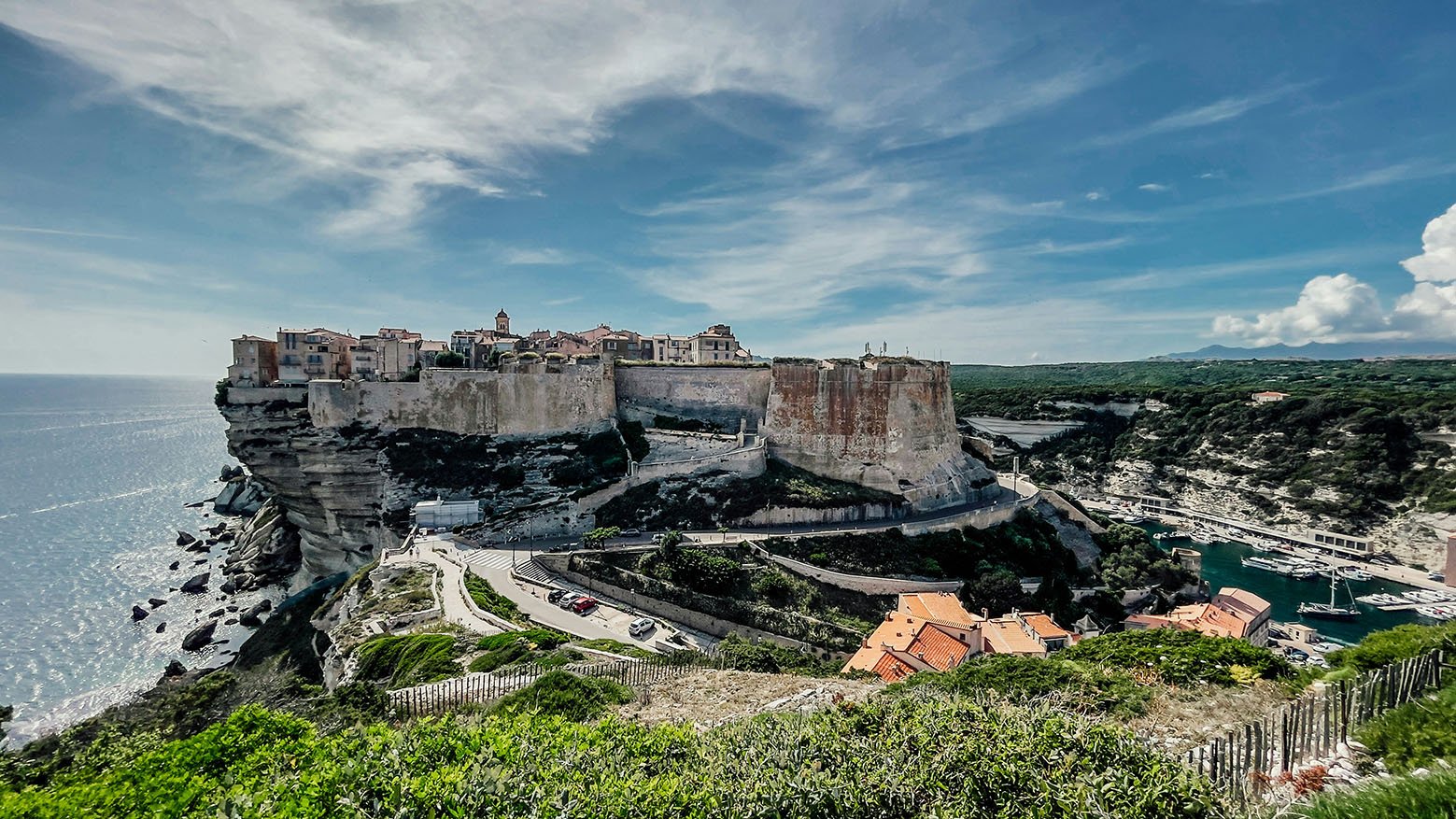 bonifacio-corsica Photo by <a href="https://unsplash.com/@gts_1960?utm_content=creditCopyText&utm_medium=referral&utm_source=unsplash">Georges GTS</a> on <a href="https://unsplash.com/photos/a-scenic-view-of-a-city-on-the-edge-of-a-cliff-pGZF0L6PxAg?utm_content=creditCopyText&utm_medium=referral&utm_source=unsplash">Unsplash</a>